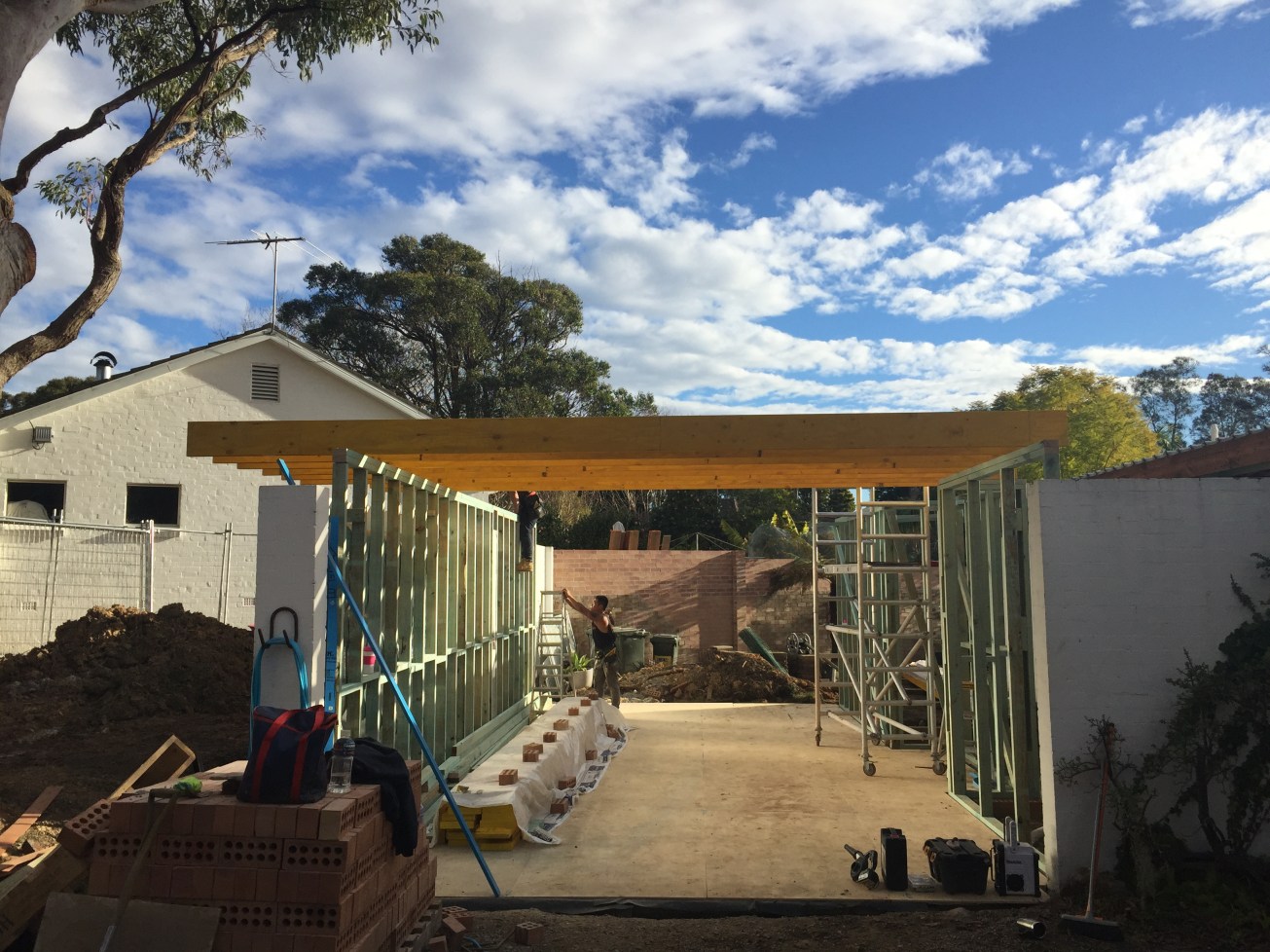 August 2016: With the first part of the extension all framed up and windows in, the team begins construction of the new master bedroom over the old carport. This shows the slab has been laid and the original brick wall has been reinforced ready for framework. 9 metres of concrete was quite something. As the carports in most P&S homes were at the side or front of the property, you can see ours here at the front and adjacent to the neighbour's garage. Luckily we are not looking down on their home.